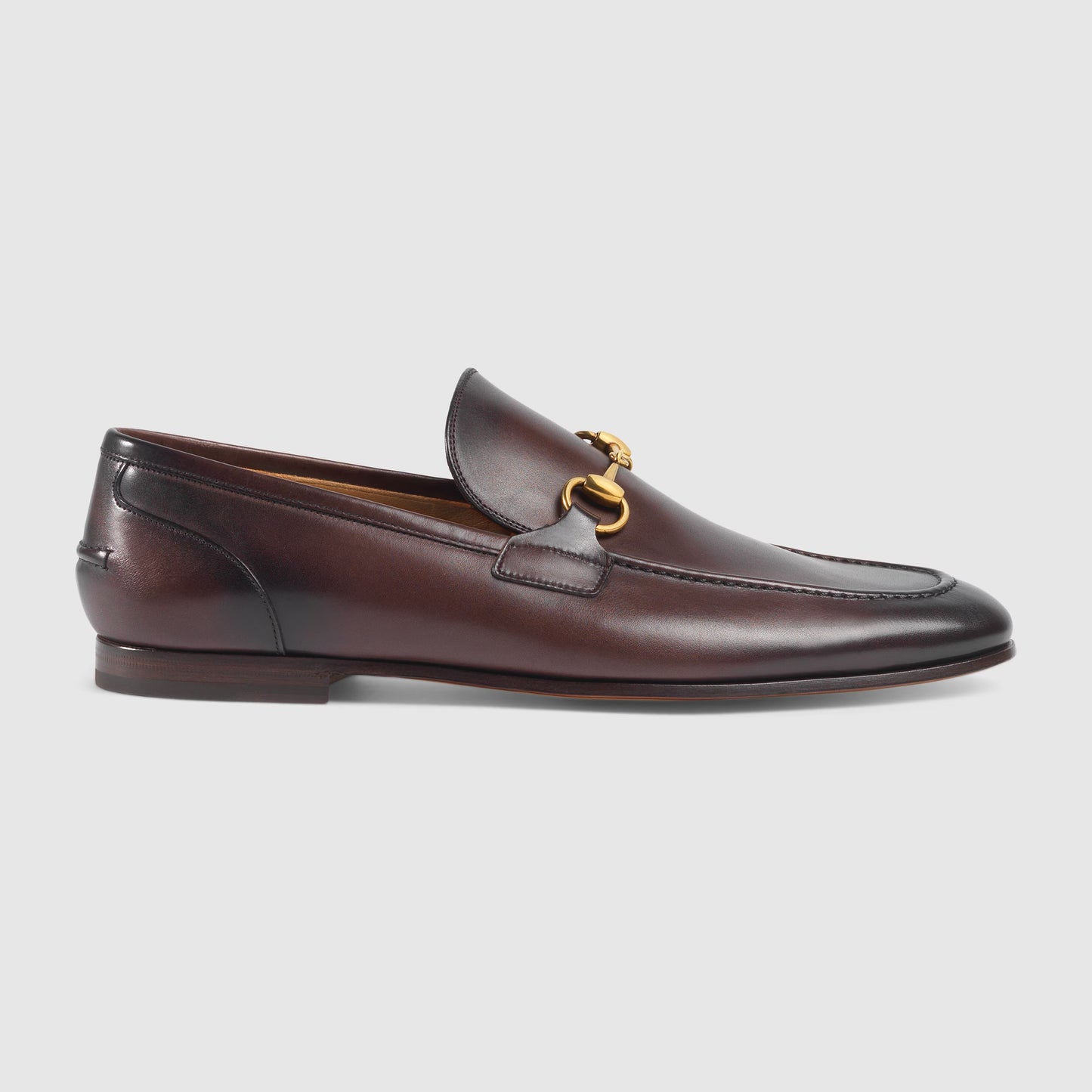 Men's GG Jordaan loafer in dark brown leather with gold buckle