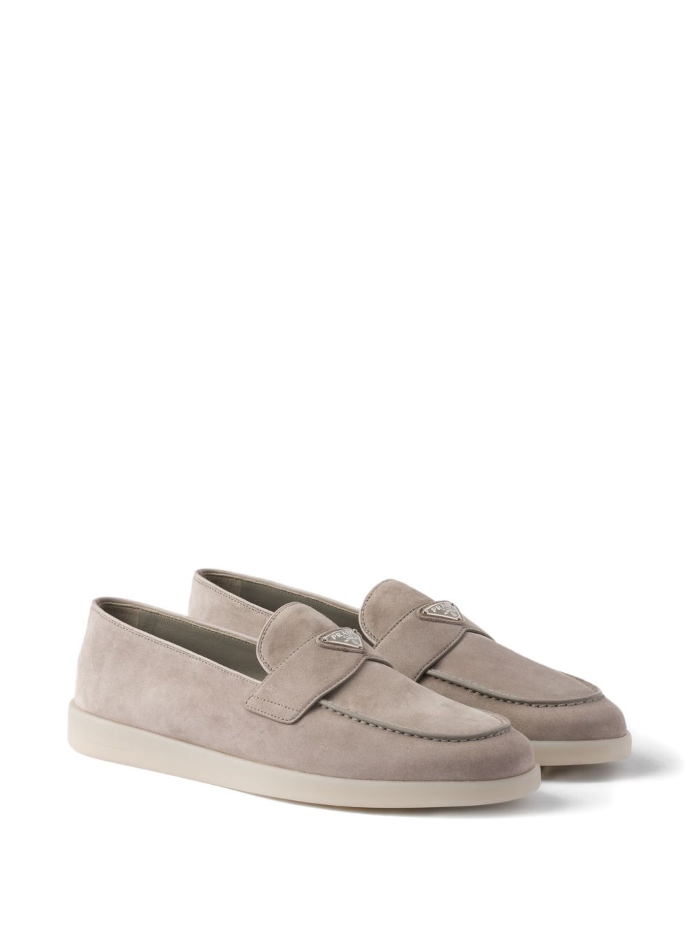 Beige suede loafers with triangular logo