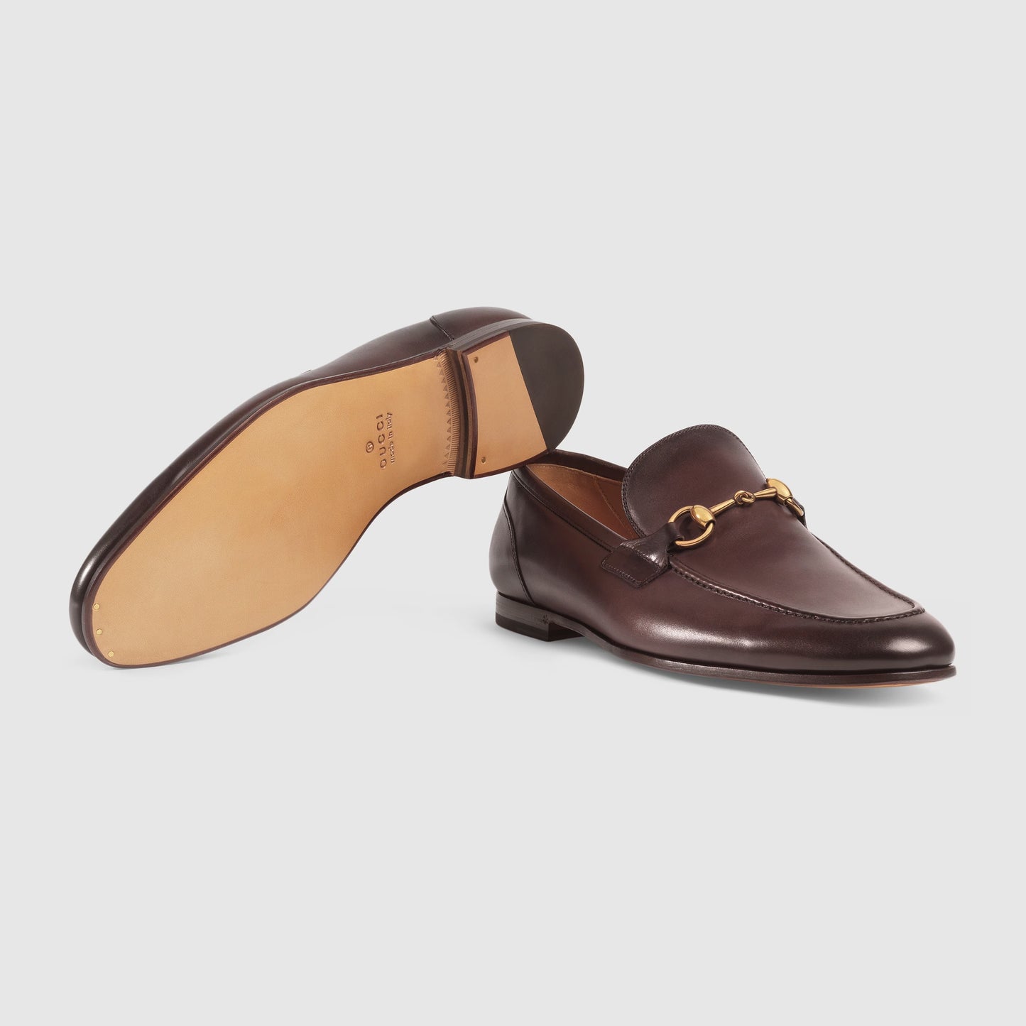 Men's GG Jordaan loafer in dark brown leather with gold buckle