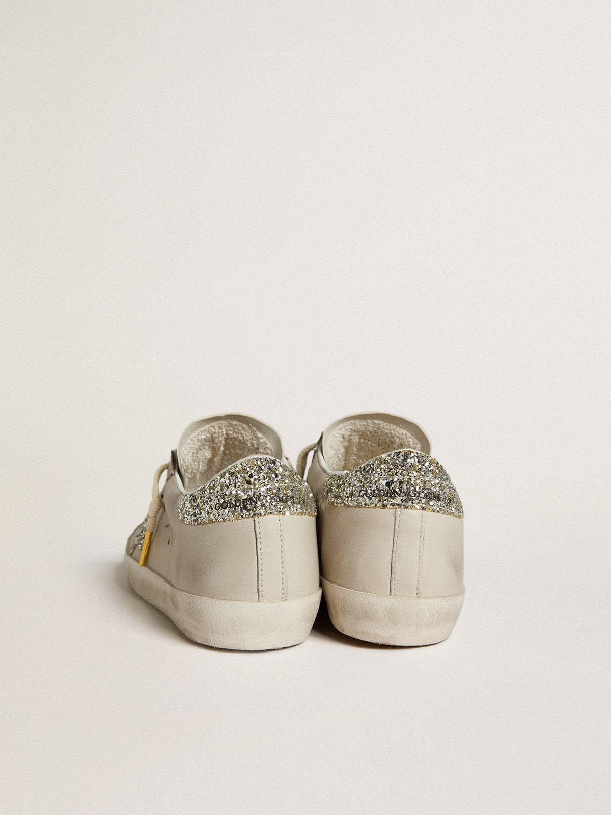 Super-Star LTD aus elfenbeinfarbenem Nappaleder mit Stern und Absatz in Platin-Glitzeroptik