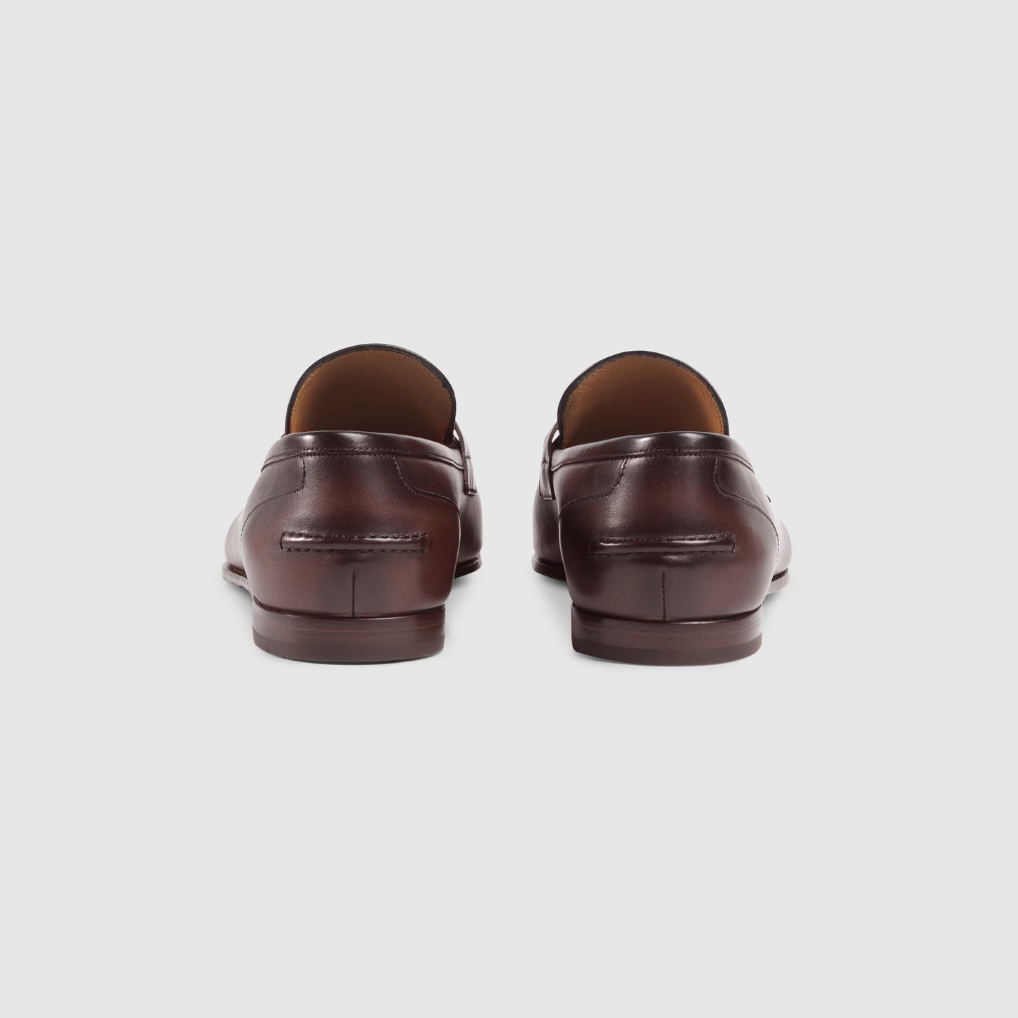 Men's GG Jordaan loafer in dark brown leather with gold buckle