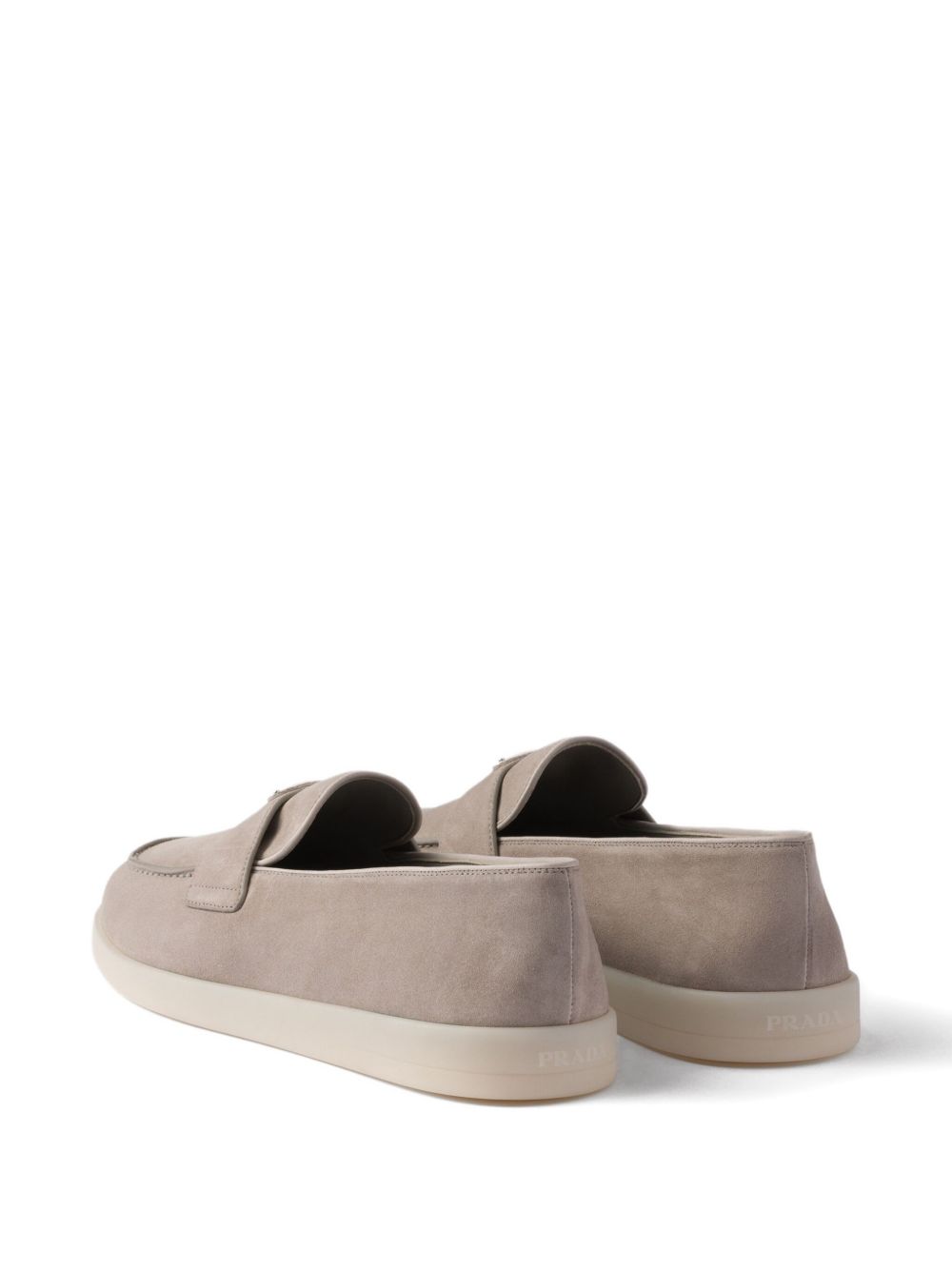 Beige suede loafers with triangular logo