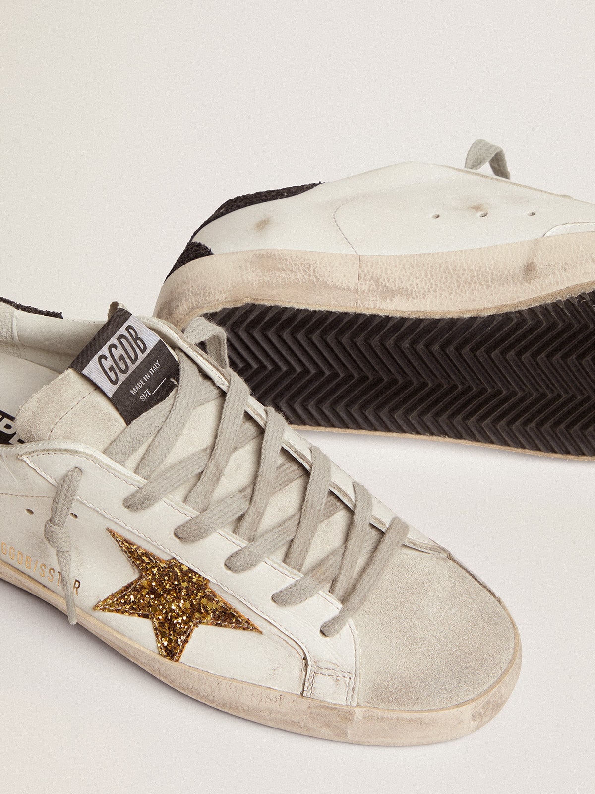Super-Star LTD mit goldenem Stern und schwarzer Glitzer-Fersenlasche