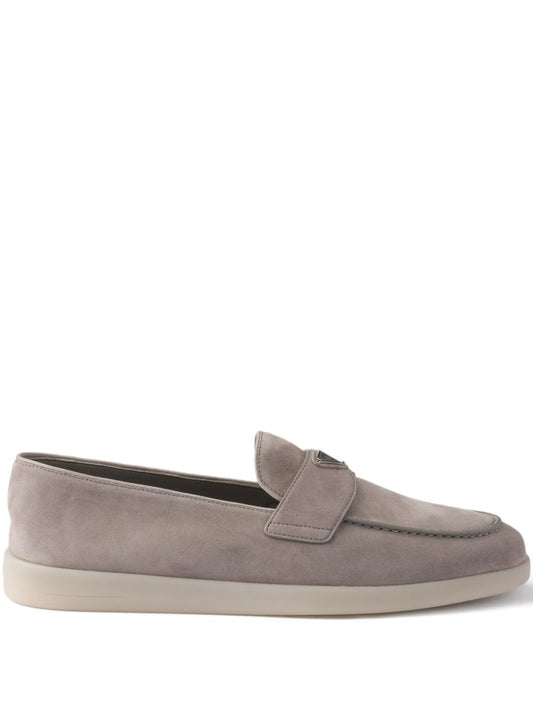 Beige suede loafers with triangular logo