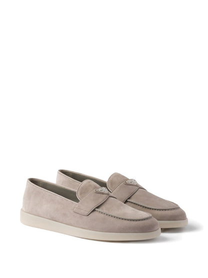 Beige suede loafers with triangular logo