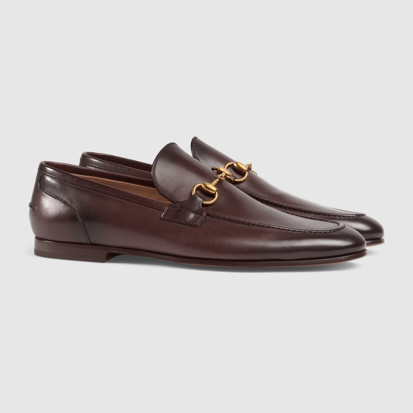 Men's GG Jordaan loafer in dark brown leather with gold buckle