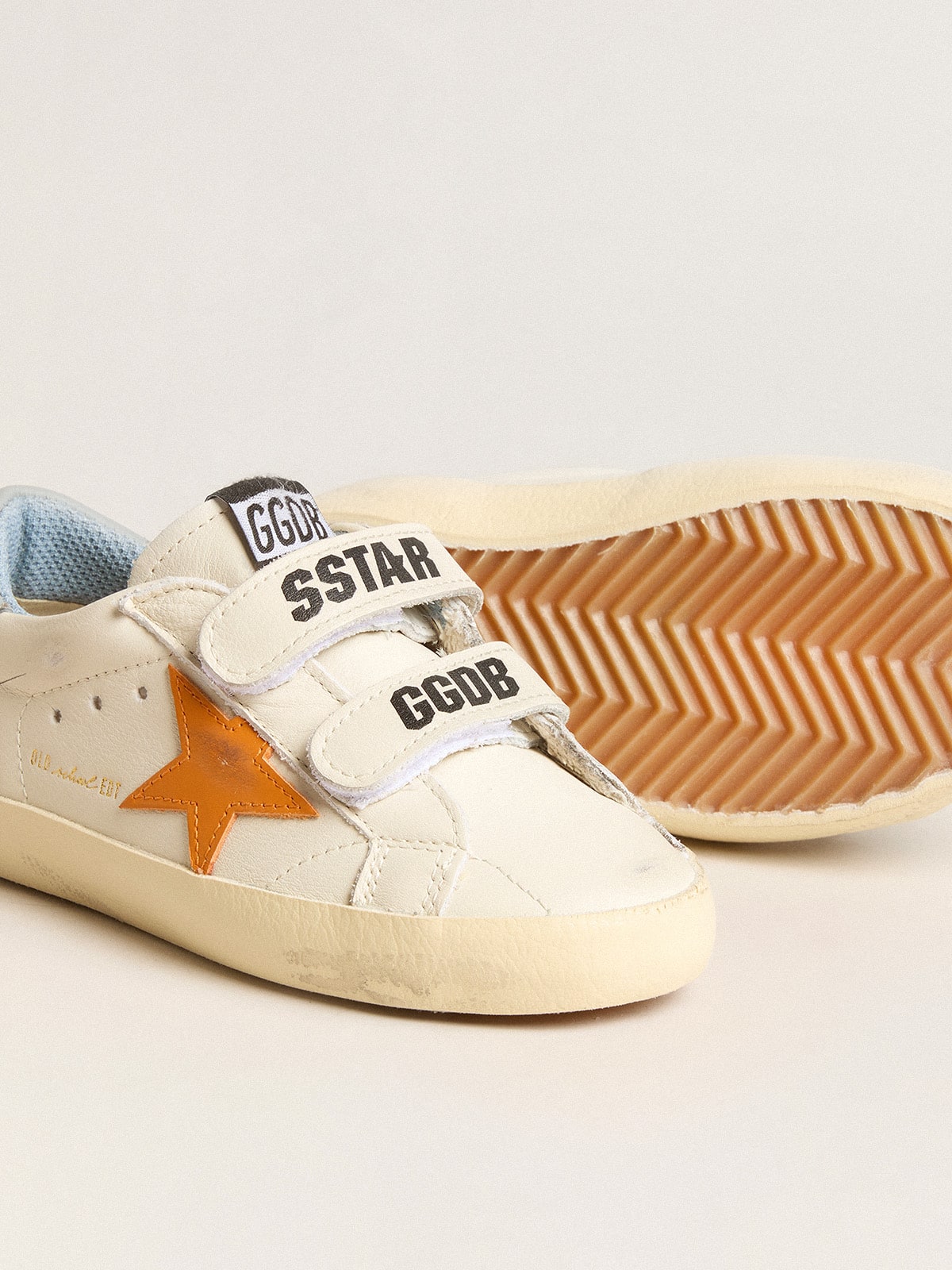 Old School Young in leather with orange star and sugar paper heel tab