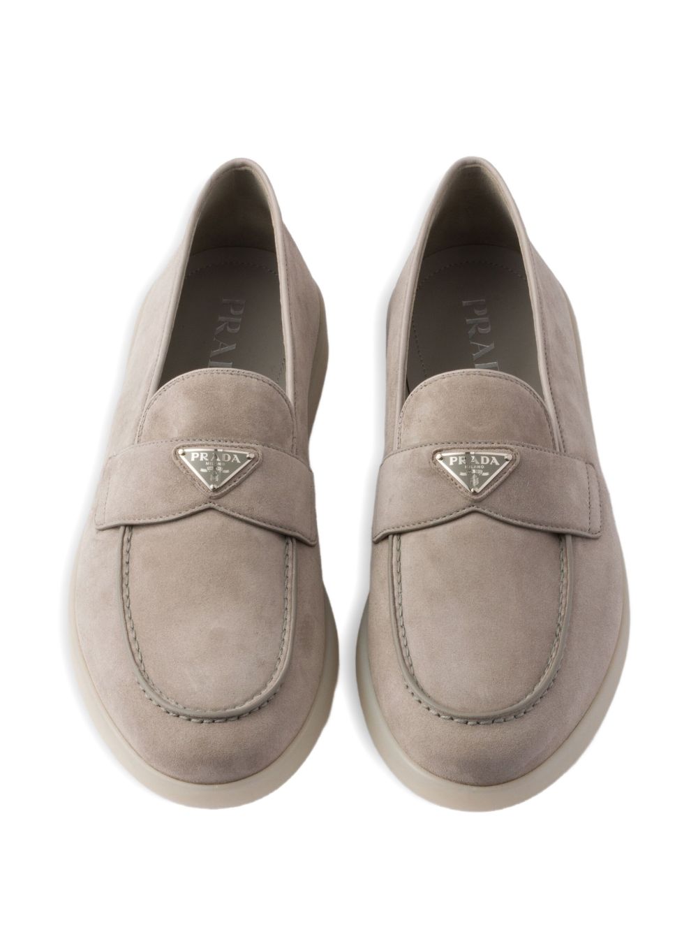 Beige suede loafers with triangular logo