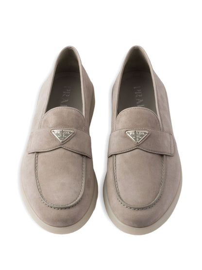 Beige suede loafers with triangular logo