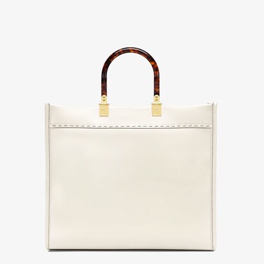 Sunshine Media in white leather