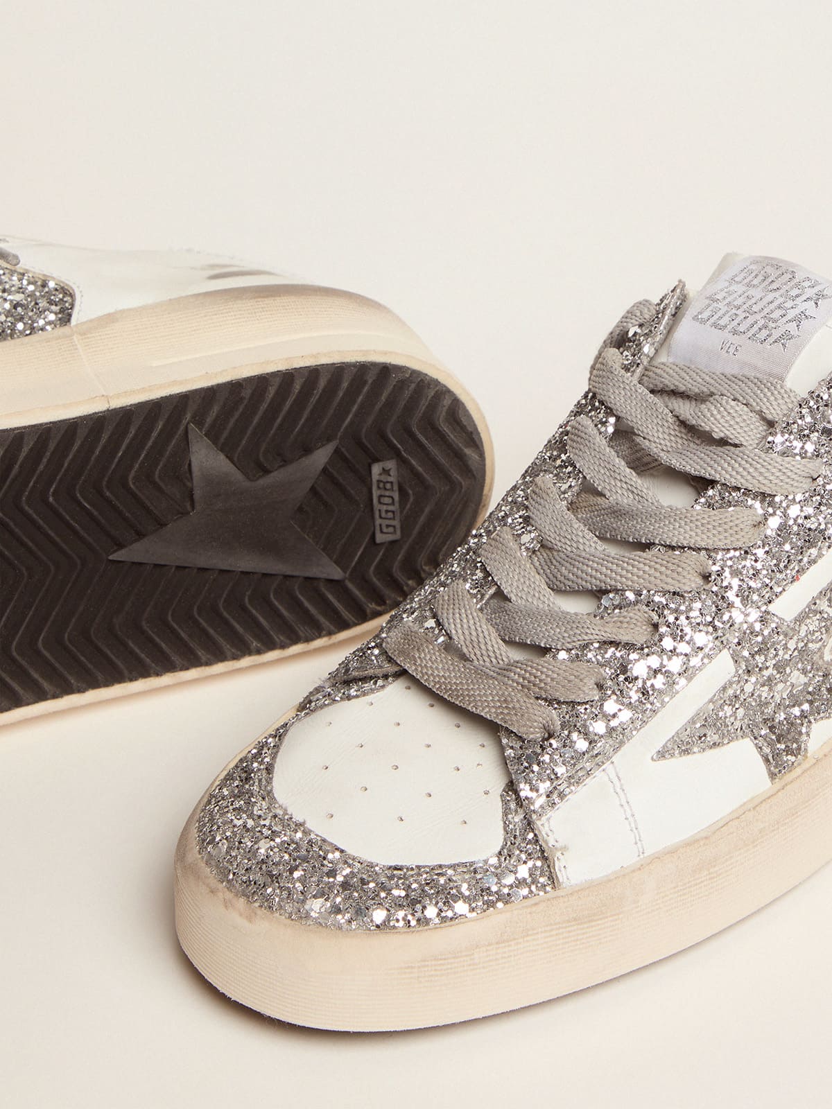 Stardan in white leather and glitter