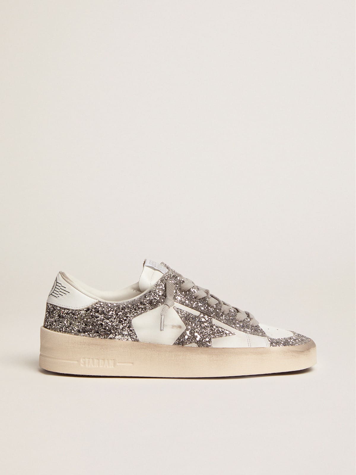 Stardan in white leather and glitter